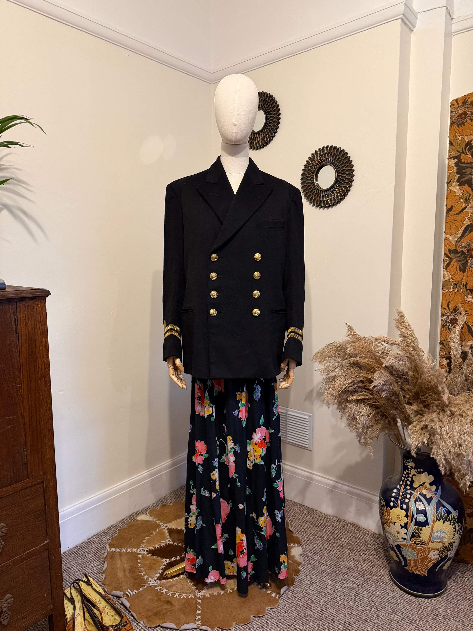 1950s navy lieutenant mess military jacket with gold buttons double breasted fastening styled with a 70s cotton floral wrap maxi skirt