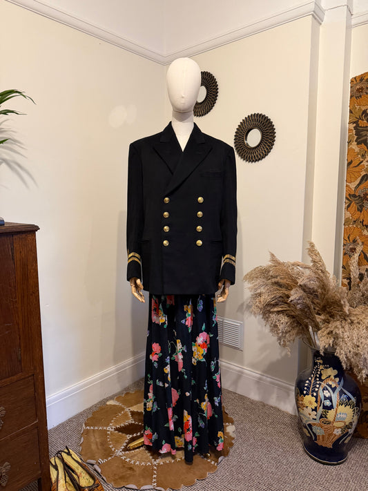 1950s navy lieutenant mess military jacket with gold buttons double breasted fastening styled with a 70s cotton floral wrap maxi skirt