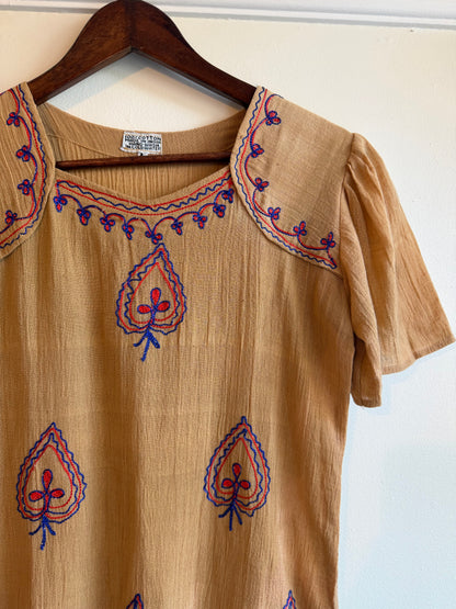 Vintage 1970s Indian tan cotton top with red and cobalt blue embroidered square neckline, oversized collar, decorative spade motifs and short sleeves.