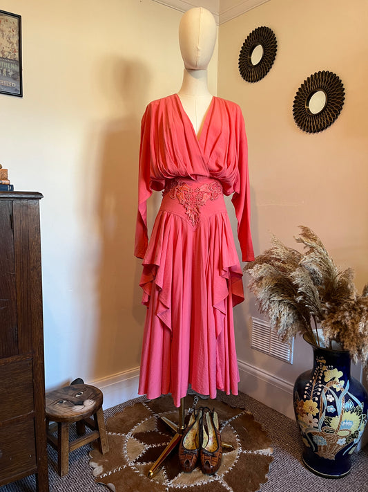 Vintage 1980s Coral pink waterfall dress with v neckline and appliqué waistband, batwing sleeves, and heavy pleats. Gorgeous vintage wedding guest dress or summer garden party dress very flattering 