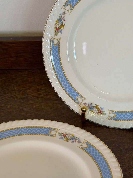 Pair of vintage Johnson Bros Old English Eastbourne plates with powder blue patterned borders, colourful floral sprays, scalloped edges and gold detailing.